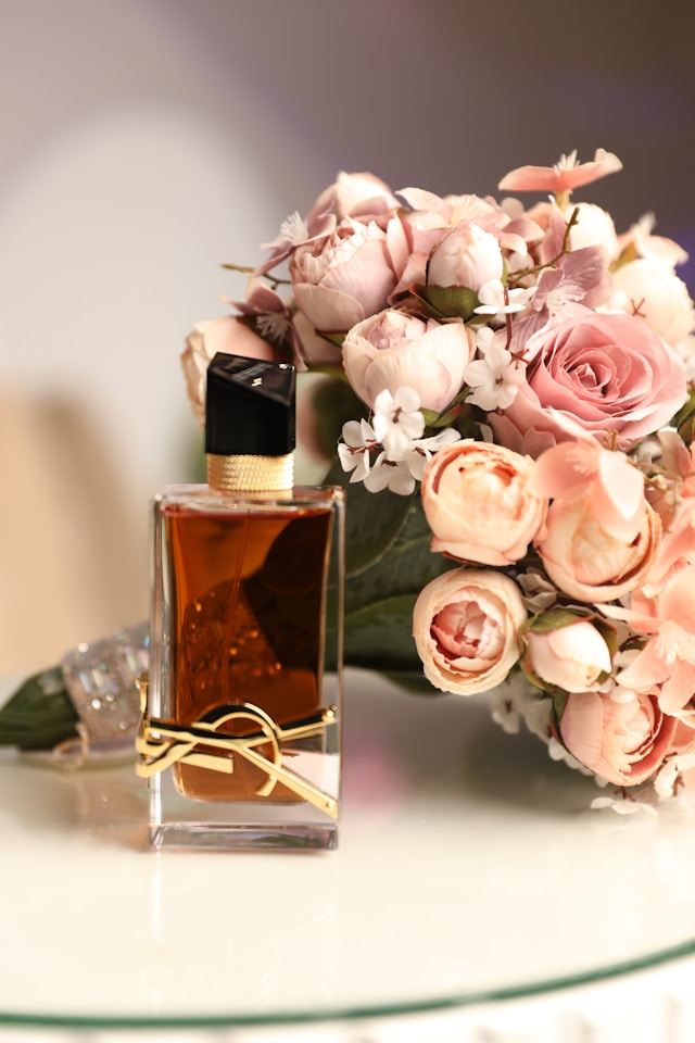 Perfume bottle with pink roses