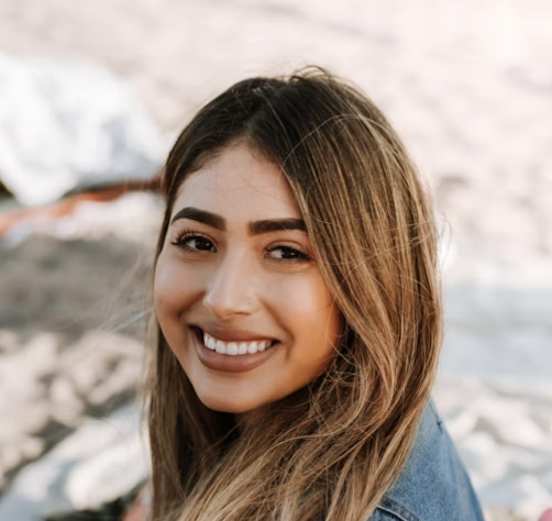 Smiling woman in jeans jacket